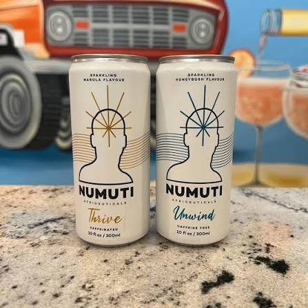 Two NuMuti cans on a counter