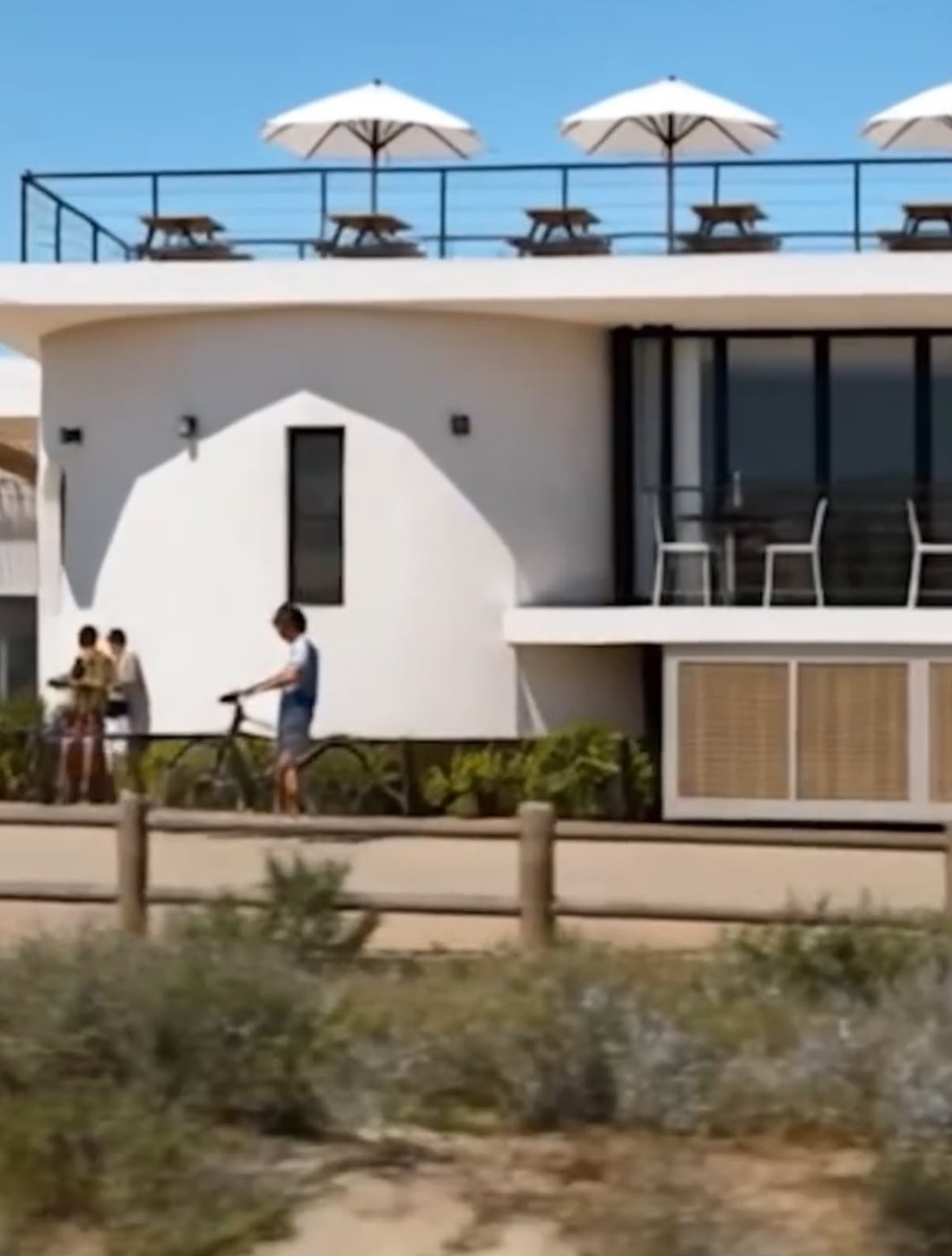 Clubhouse frontage with rooftop parasols
